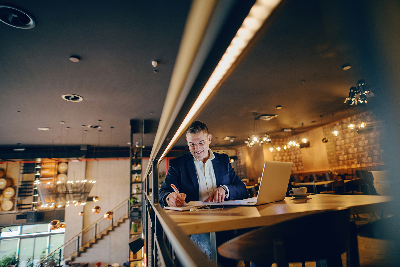An owner or manager reviewing clear reports on a tablet; confident, data-driven