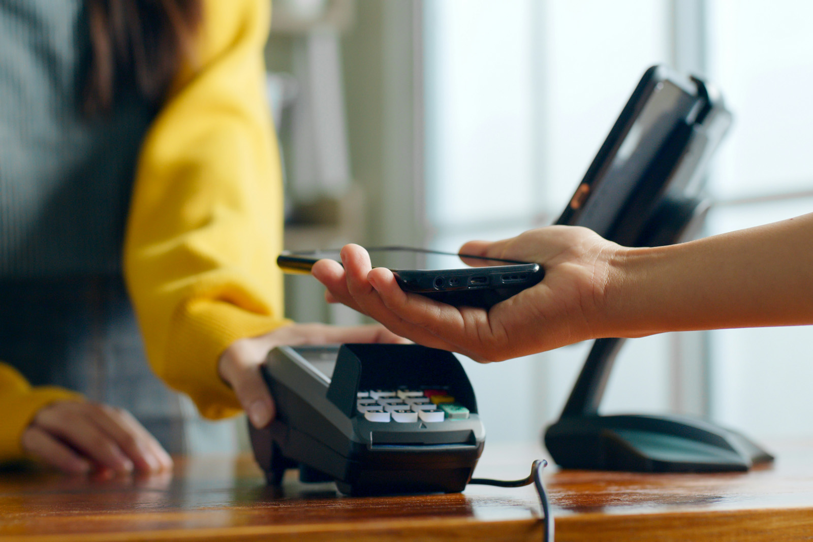 Countertop smart terminal on a service-desk, tire display or waiting area behind