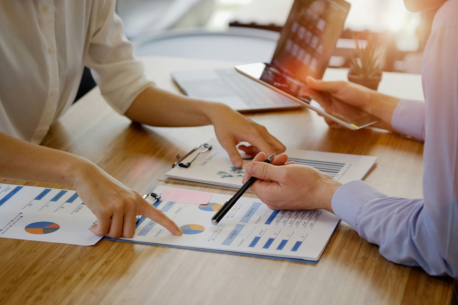 Business owner reviewing a merchant statement with a ZeroG specialist to find processing savings