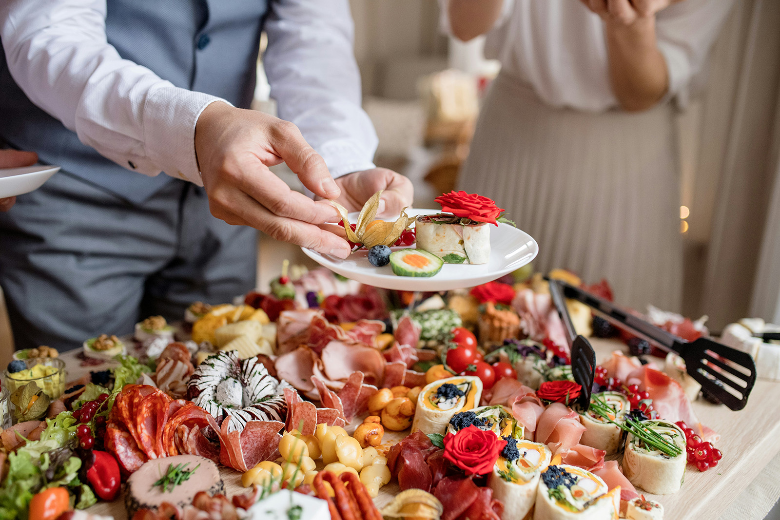 A beautiful catering platter or boxed order ready for pickup, or staff prepping a big order; abundant and p…