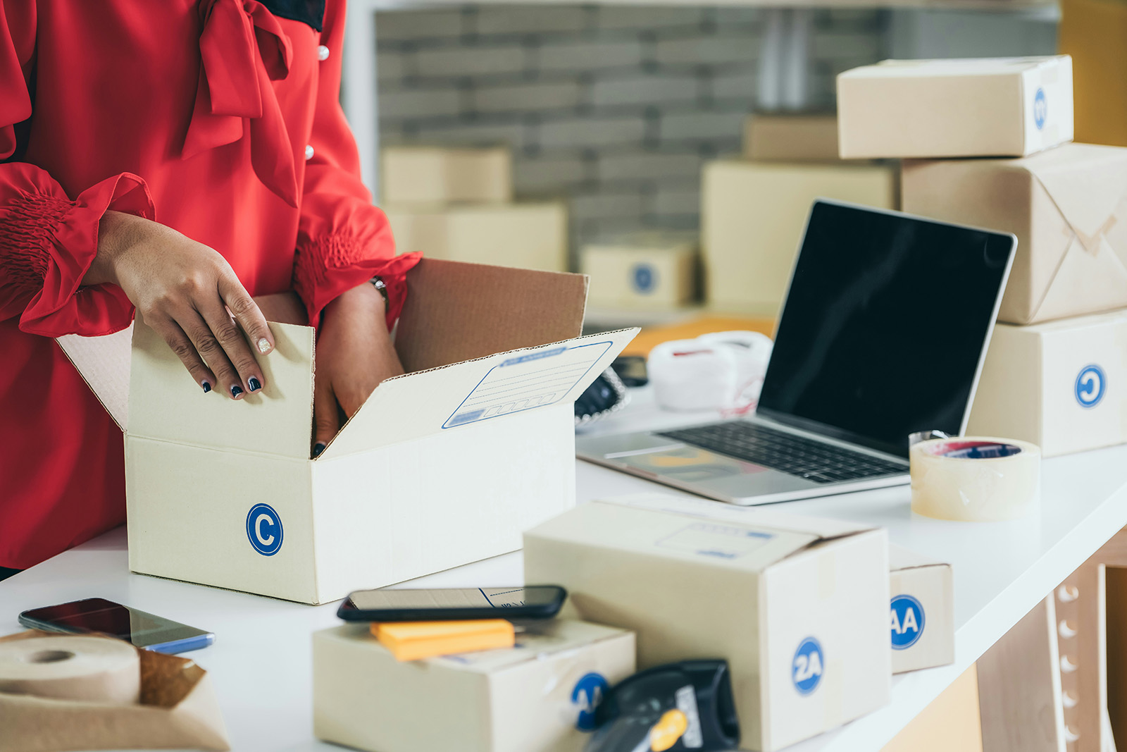 Packing an online order in the shop, or a tidy product catalog; organized commerce