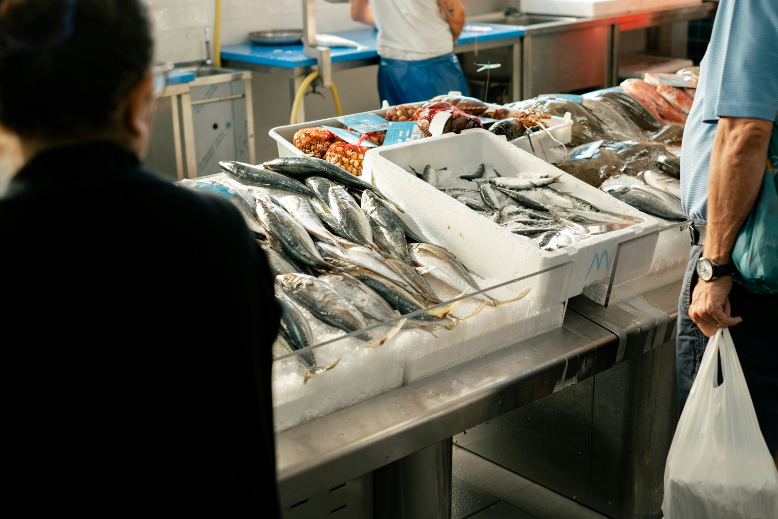 Fishmonger at the seafood counter