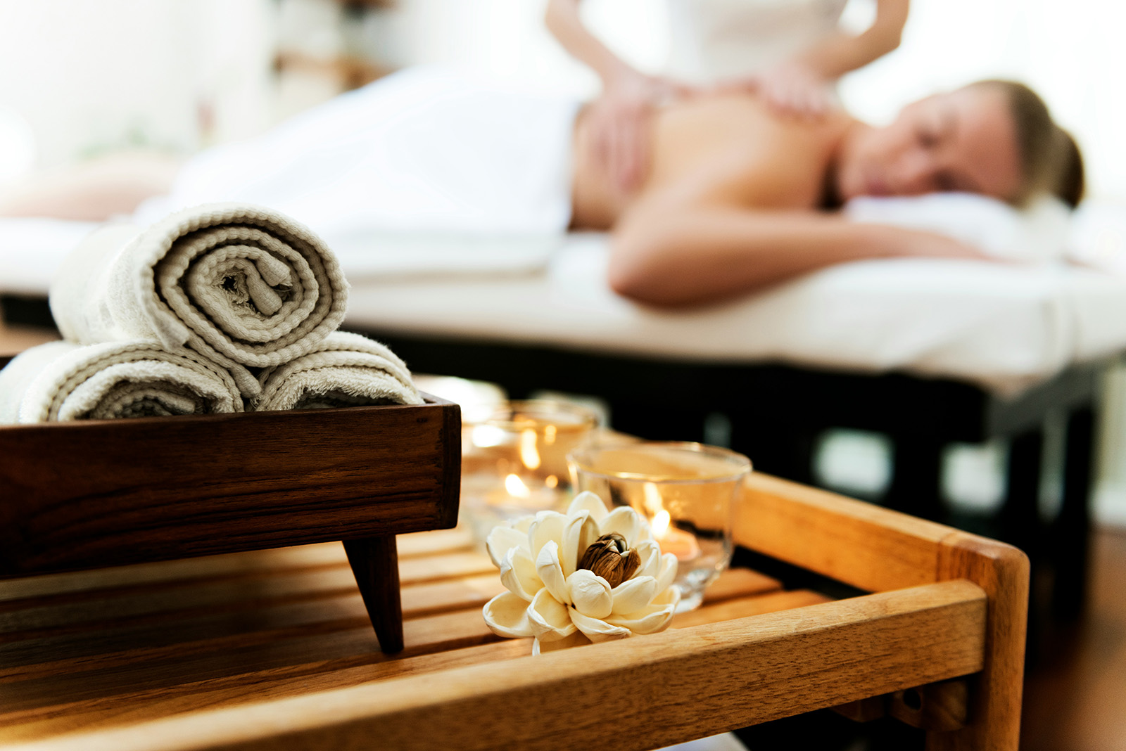 A serene spa treatment room, or a client rebooking at the front desk; calm and premium